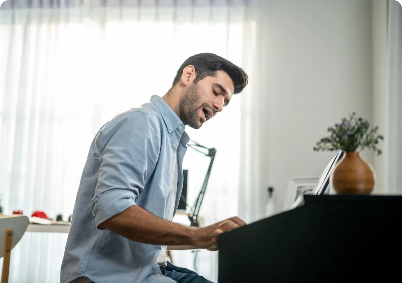 Man playing piano at home
